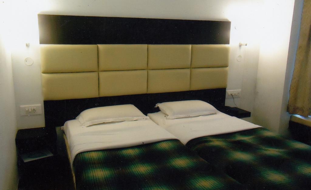 Hotel New Rajdarshan Madikeri Rum bild